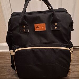 Debug Black and Tan Diaper Bag With Changing Pad Extension